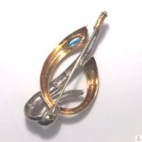 Broche de oro bicolor con topacio azul y circonitas-b