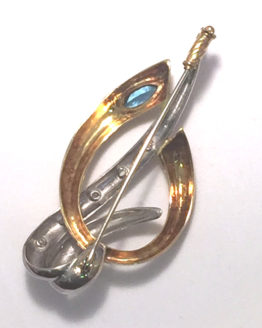 Broche de oro bicolor con topacio azul y circonitas-b