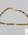 Pulsera de oro bicolor con eslabones alternos