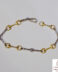 Pulsera de oro bicolor maciza con estribos