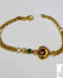 Pulsera de oro amarillo con eslabones rolo y 1 corazón